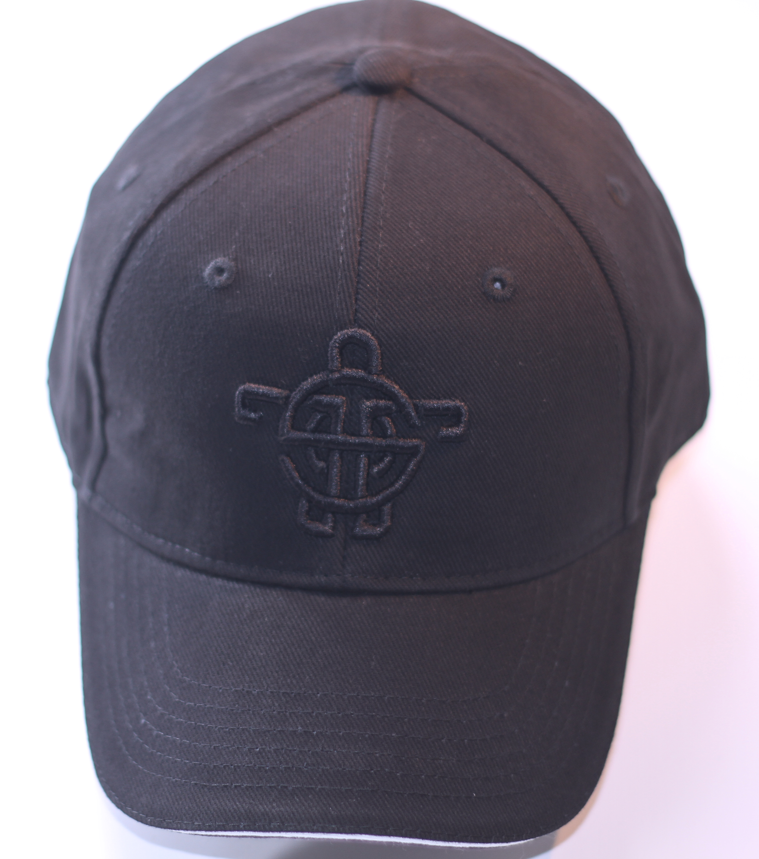 black cap 2 - A structured six-panel cap carrying the Tarsah turtle in raised, tone-on-tone embroidery